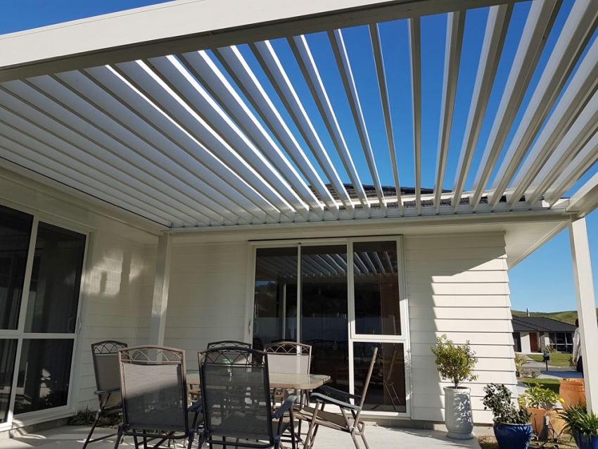Freestanding Bask Louvre Roof fitted on North Facing Patio opened up to let the winter sun in